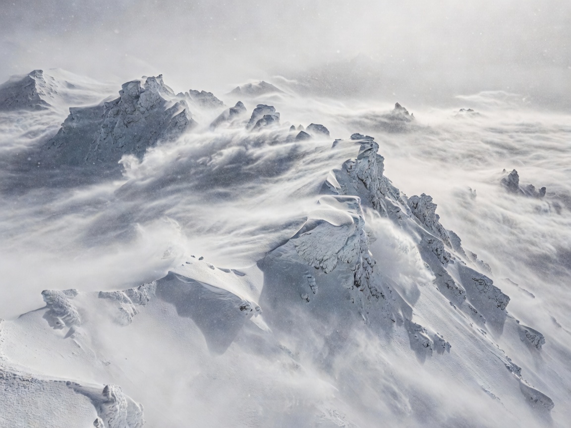 Snowbound mountainous Ural ridge with a solitary desolate camp